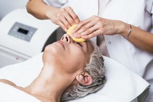 a woman receives a pca peels treatment