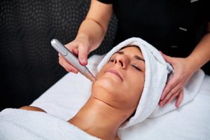 a woman benefits from a microneedling treatment