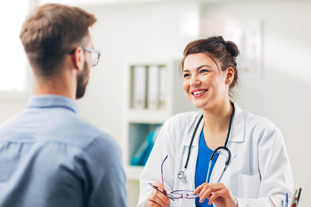 What to Expect During Hormone Optimization a doctor teaches a patient what is hormone optimization