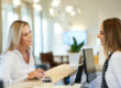 Woman talks to a receptionist at a medispa in Maryland