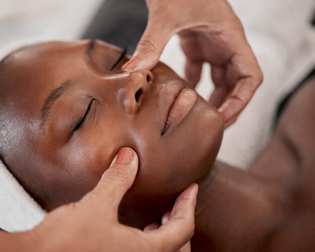 How Long Does Chemical Peeling Last Woman lays down and gets face massaged during chemical peeling process, after researching how long chemical peeling lasts
